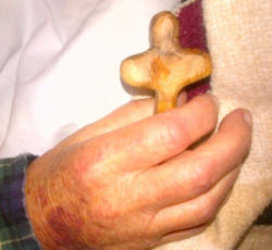 Hand holding cross